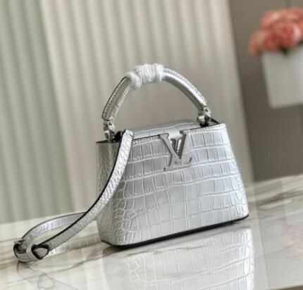 Louis Vuitton Capucines bag in a silver or metallic color