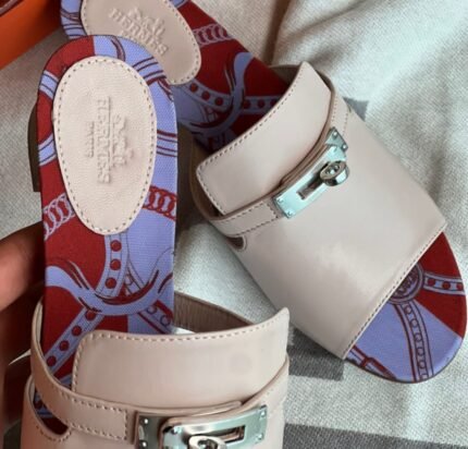 Hermès Candy Sandal Mule – Coral Elegance with a Twist of Art