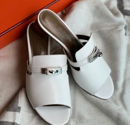 The Hermès Gigi Sandals in white